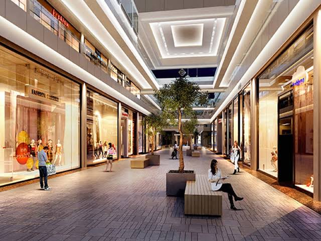 A mall concourse in Deira, shopfronts on both sides