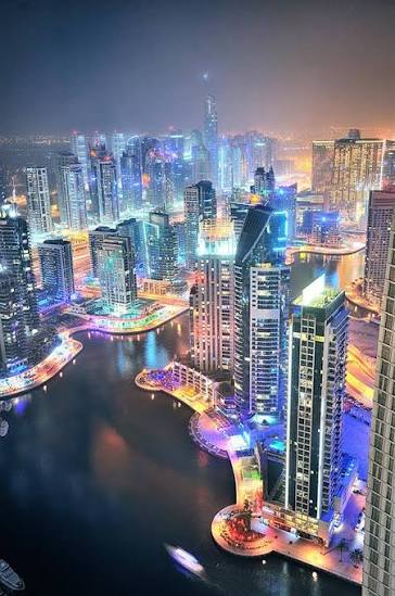The Dubai skyline at night, Bur Dubai in the distance