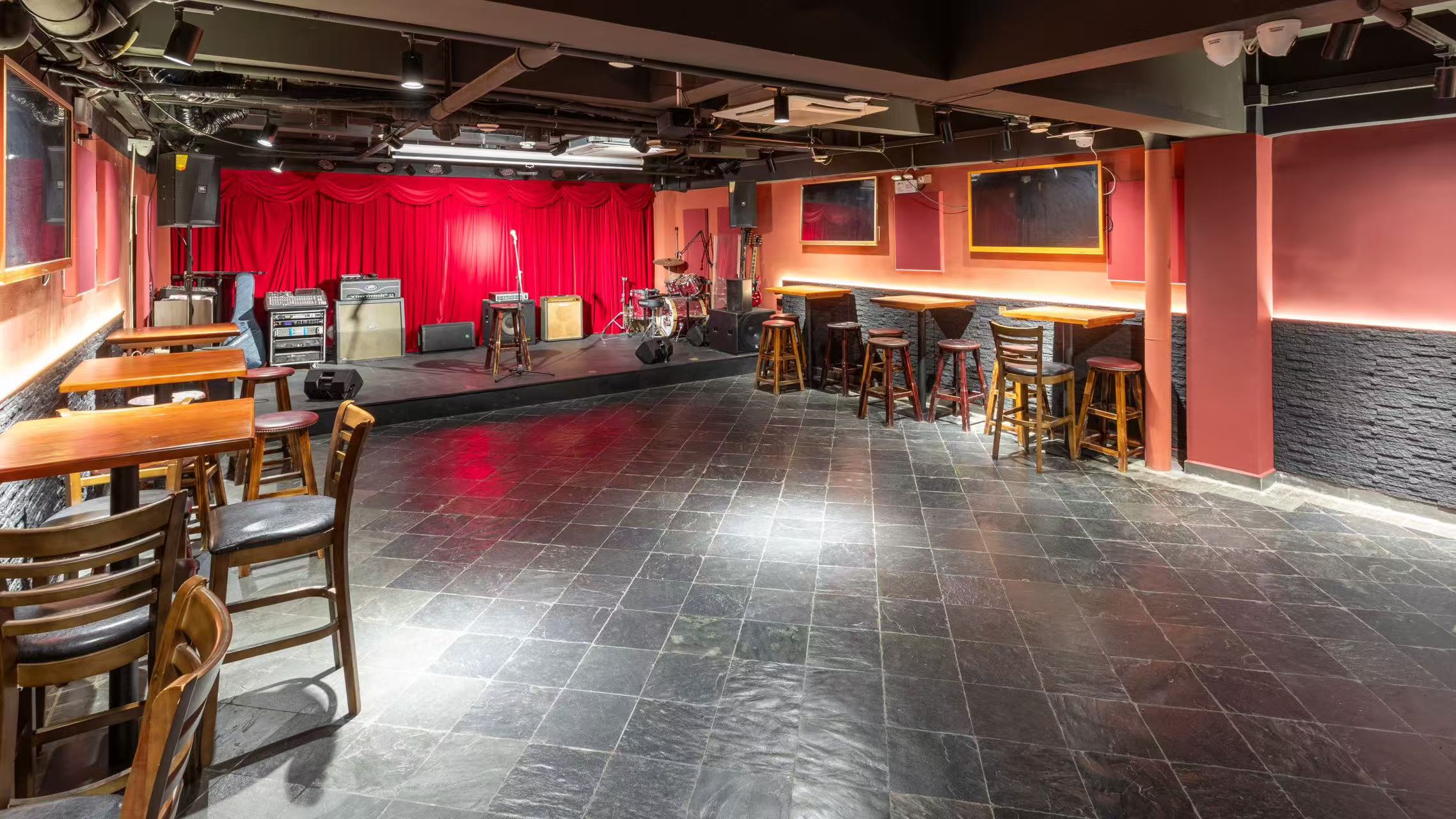 Second floor show room, stage, red curtain and backline